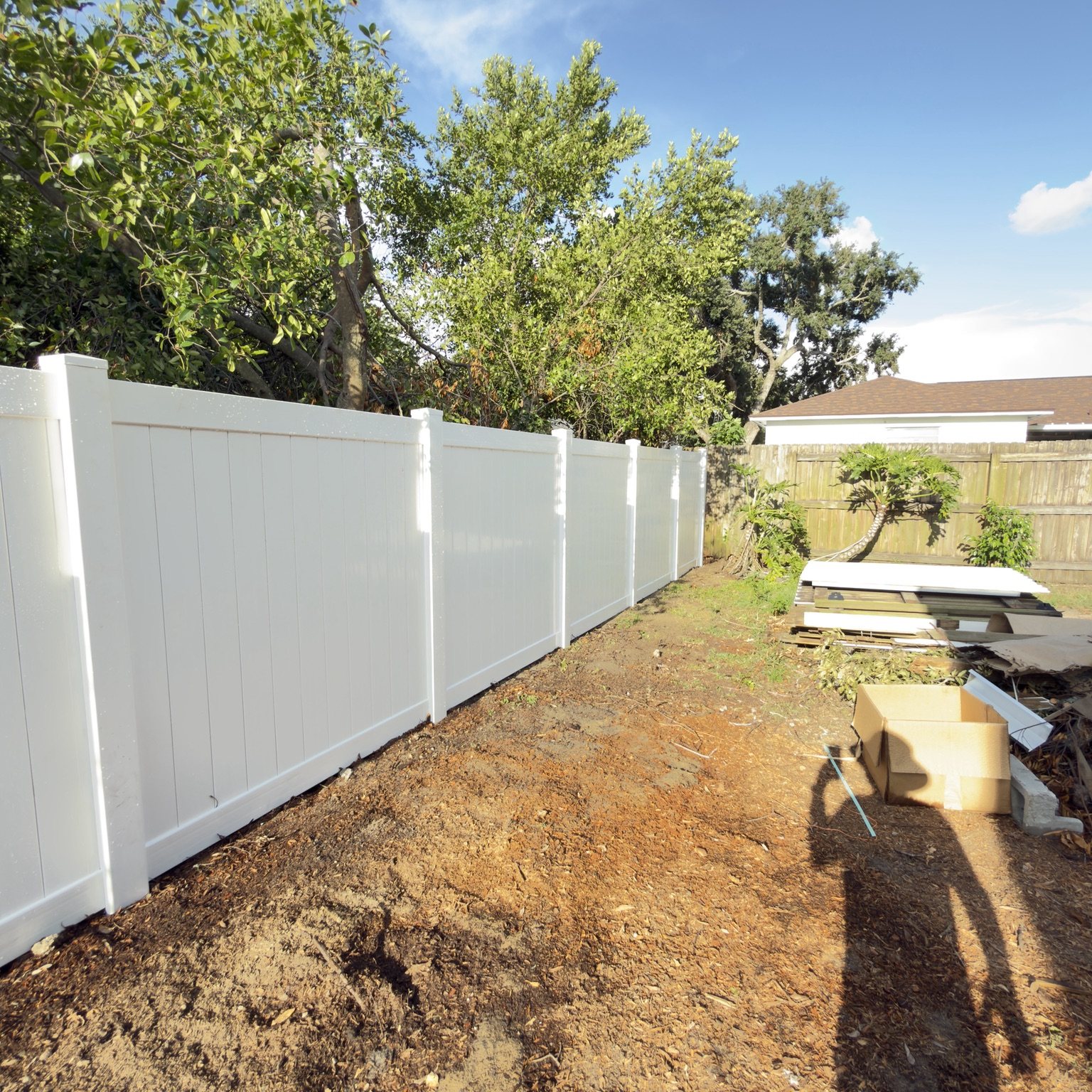 J&R completed white vinyl privacy fence project